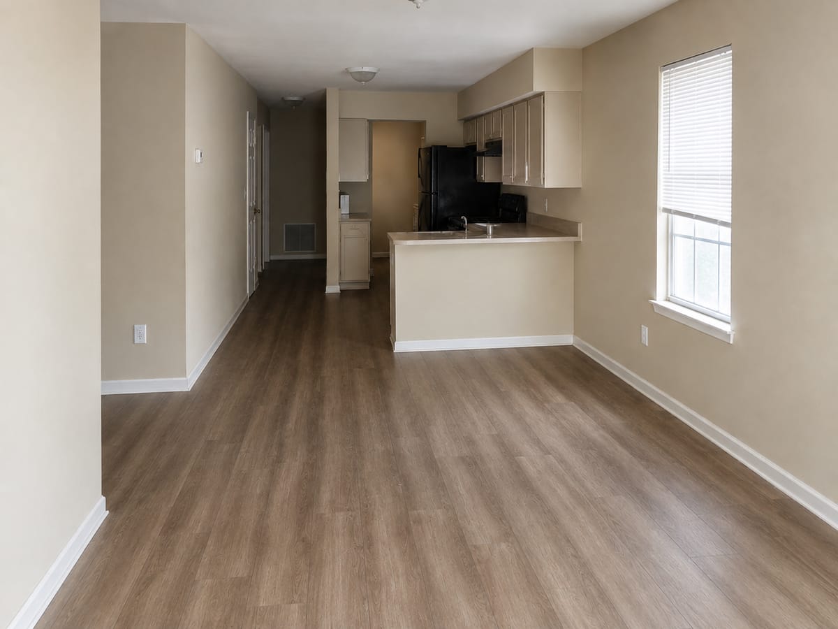 The same condo bathroom with the ceiling corner and grout cleared of film after cleaning in Sandy Springs