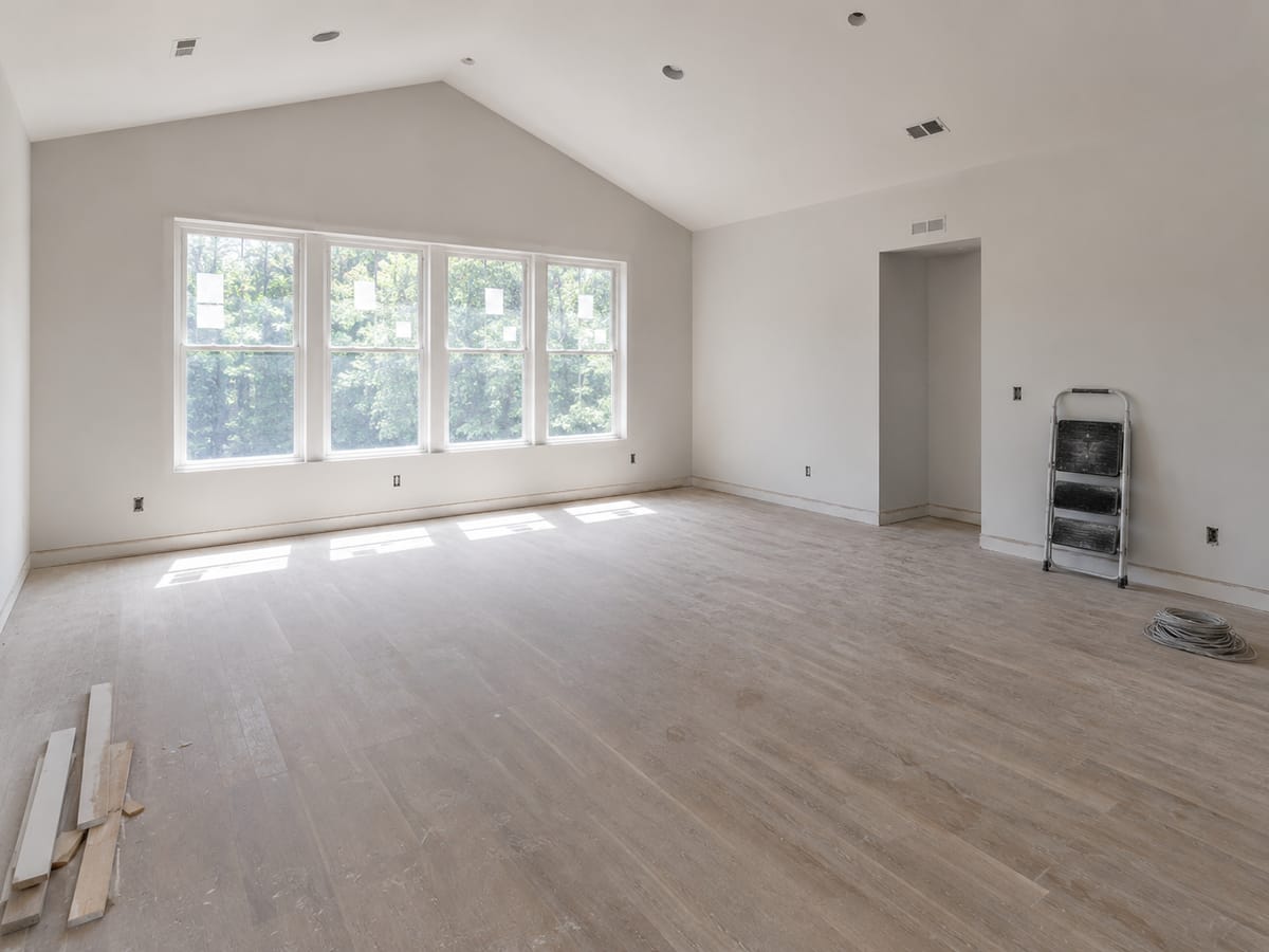 Bedroom coated in drywall dust on the window frame, sill and floor after remodeling work in Alpharetta